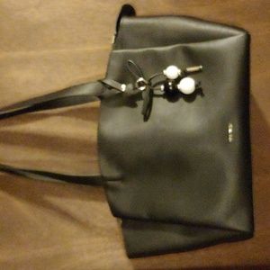Nine West, black bag with silver trim and a black and white beaded baubble